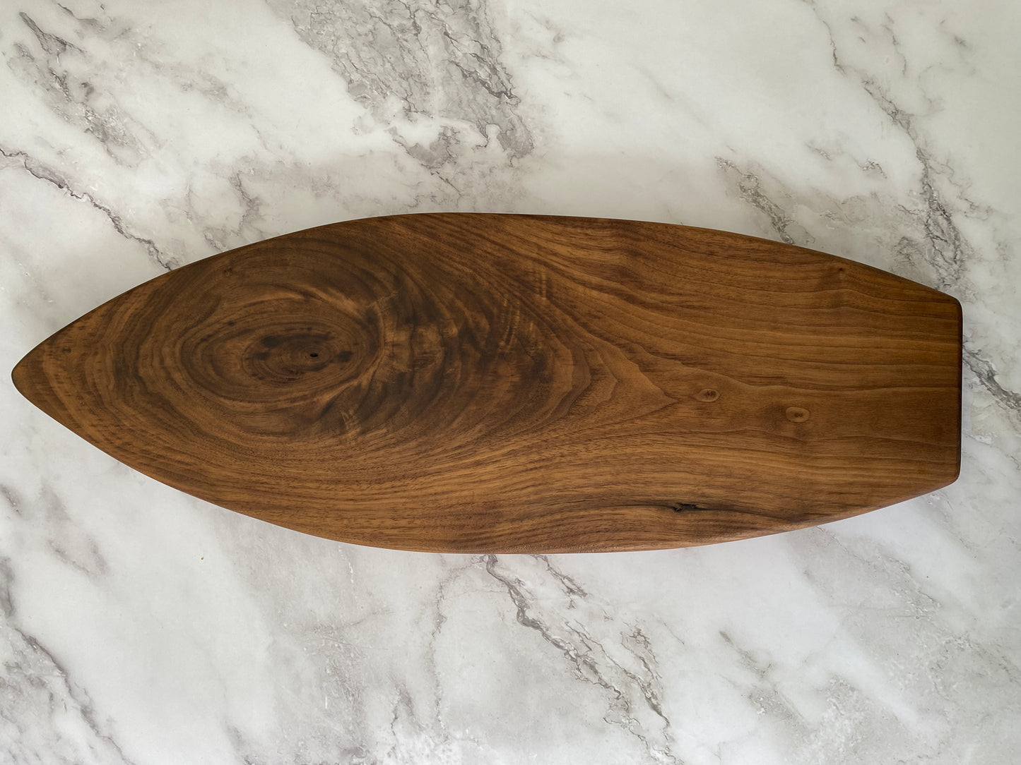 Surfboard shaped charcuterie board