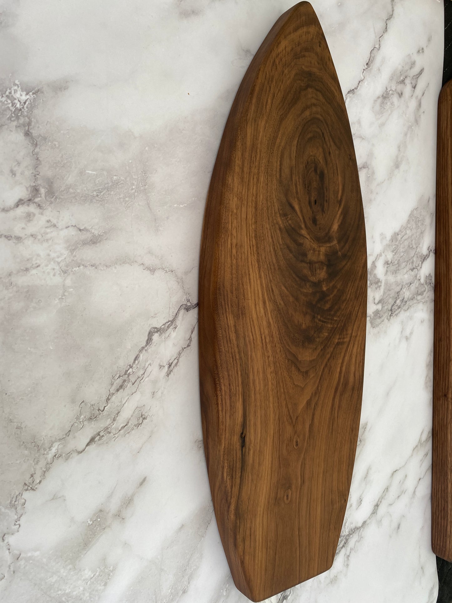 Surfboard shaped charcuterie board