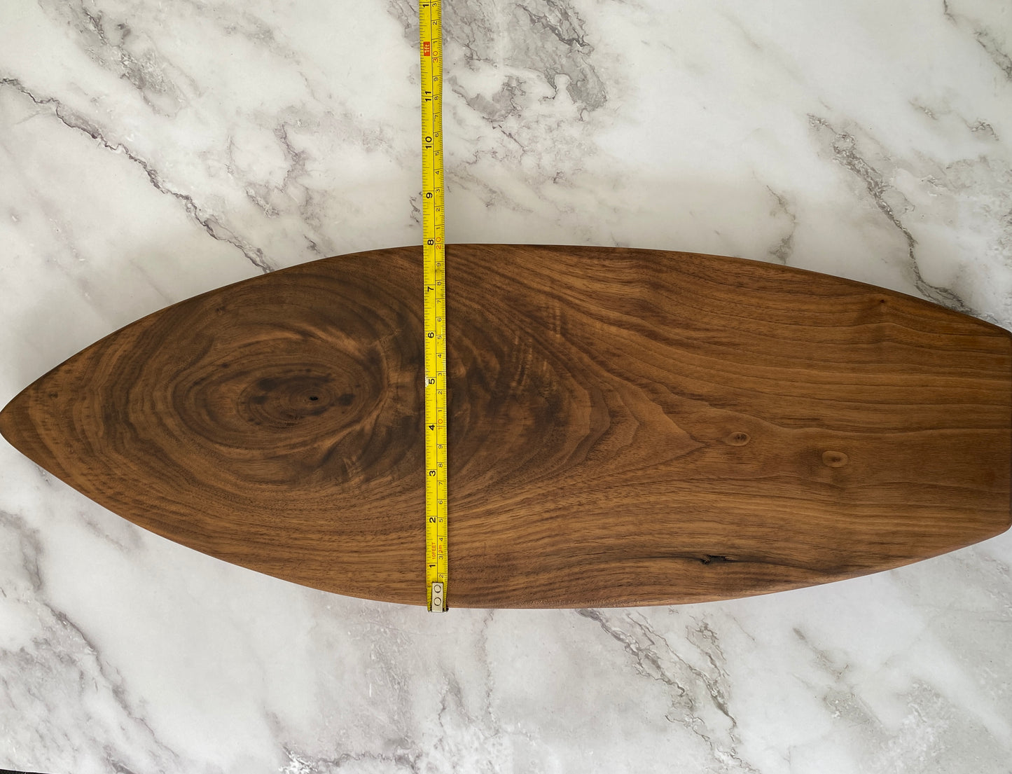 Surfboard shaped charcuterie board