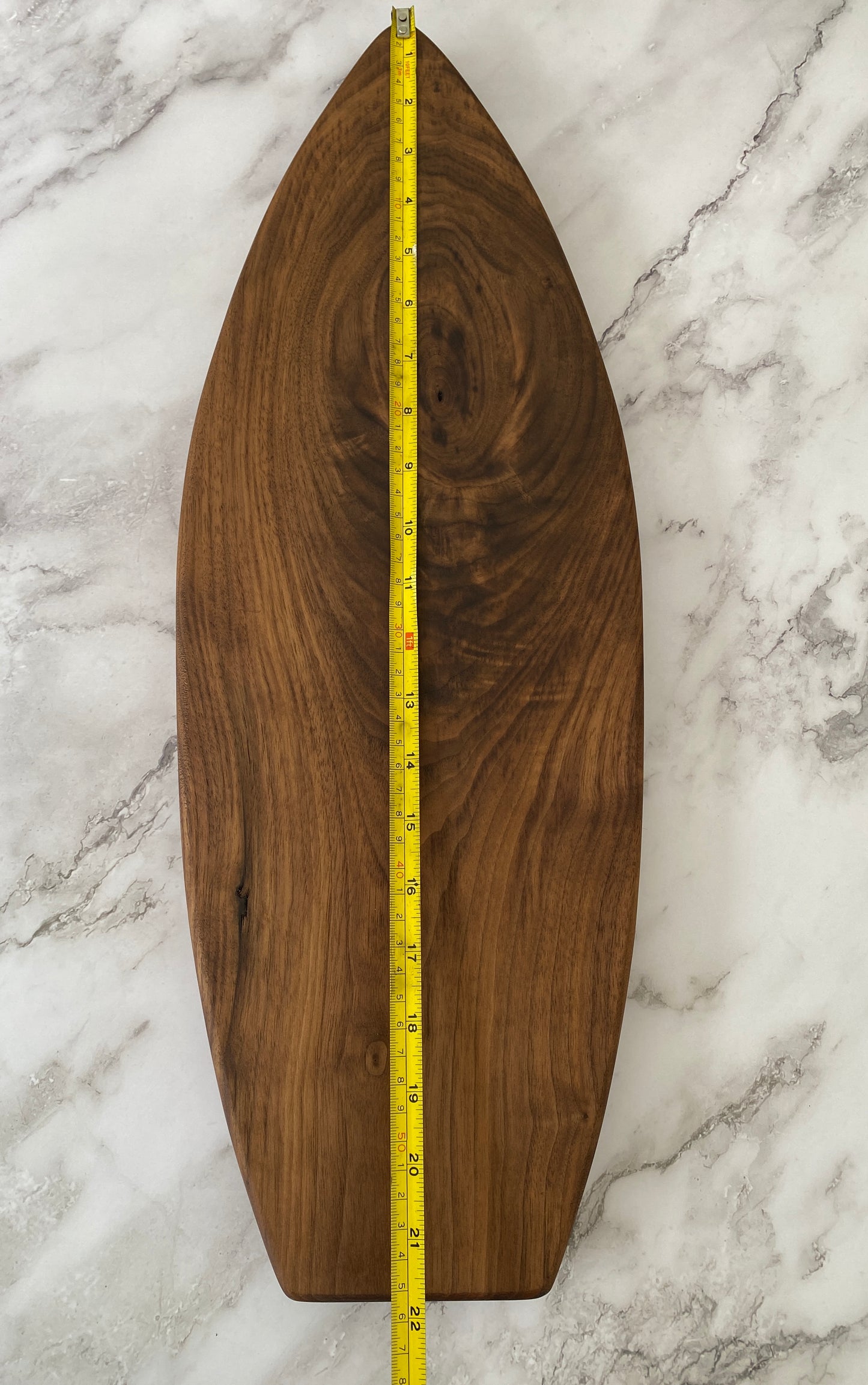 Surfboard shaped charcuterie board