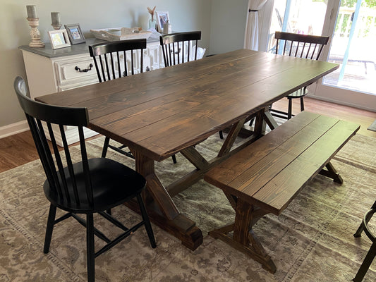 X base trestle table and matching bench in jacobean with a planked table top