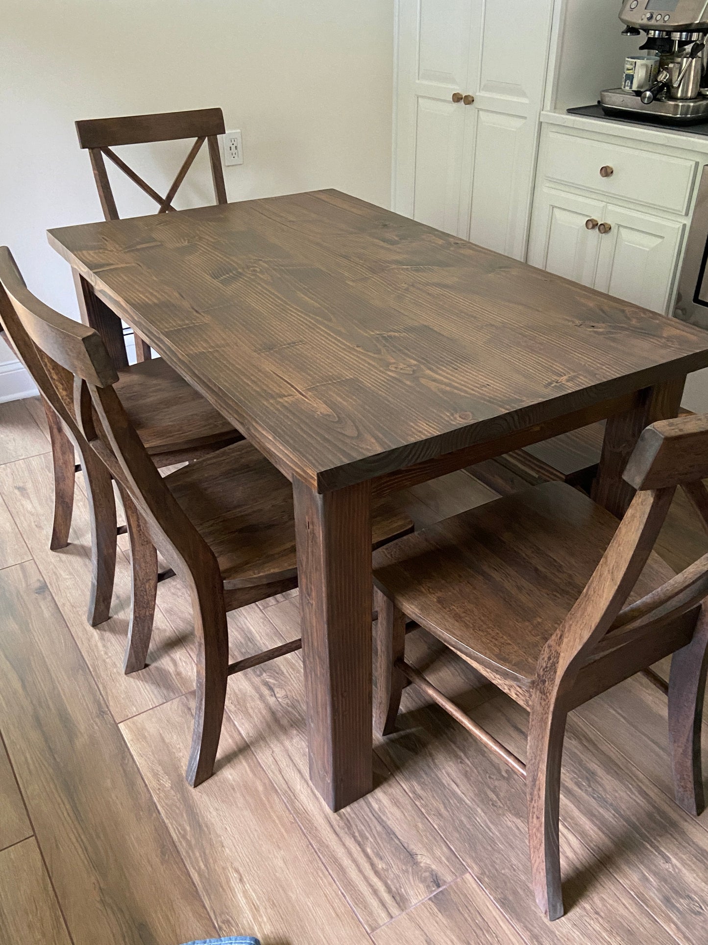 Parsons table with seamless top and 4 single X chairs and an X base bench