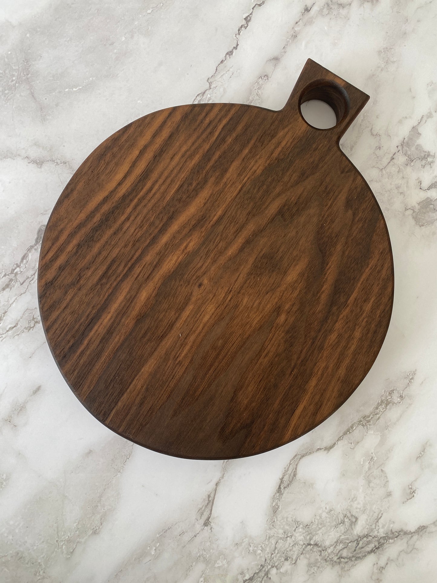 Round paddle walnut charcuterie board