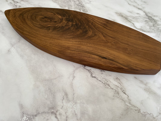 Surfboard shaped charcuterie board