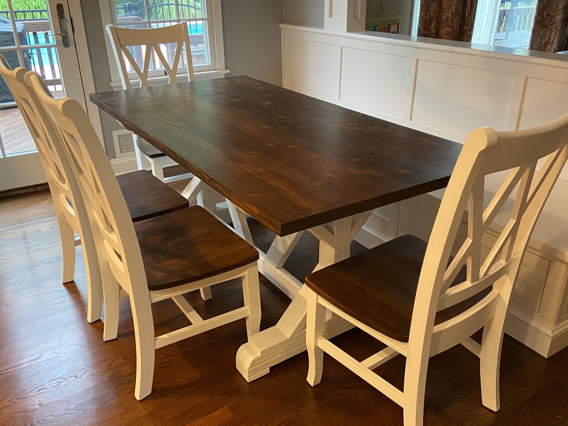 X base banquette seating with farmhouse chairs