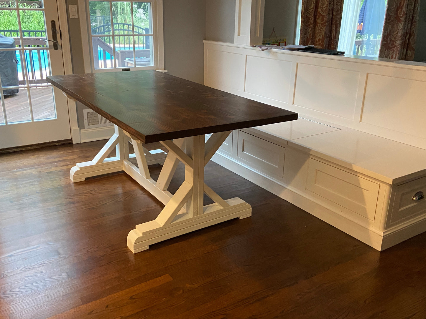Farmhouse X base table with banquette seating